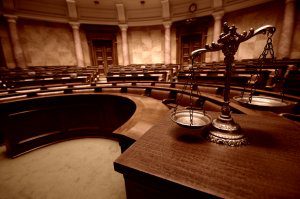 Court room with scales of justice on table