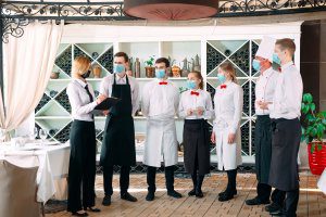 Serving crew talking - wearing masks