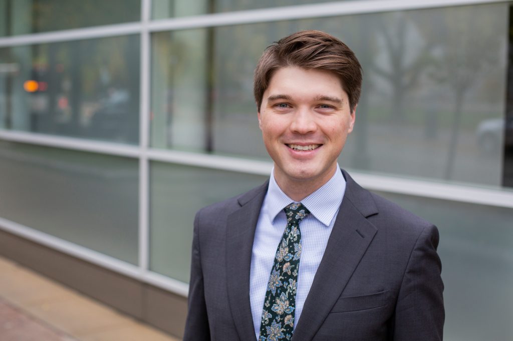 Headshot of lawyer in front of building